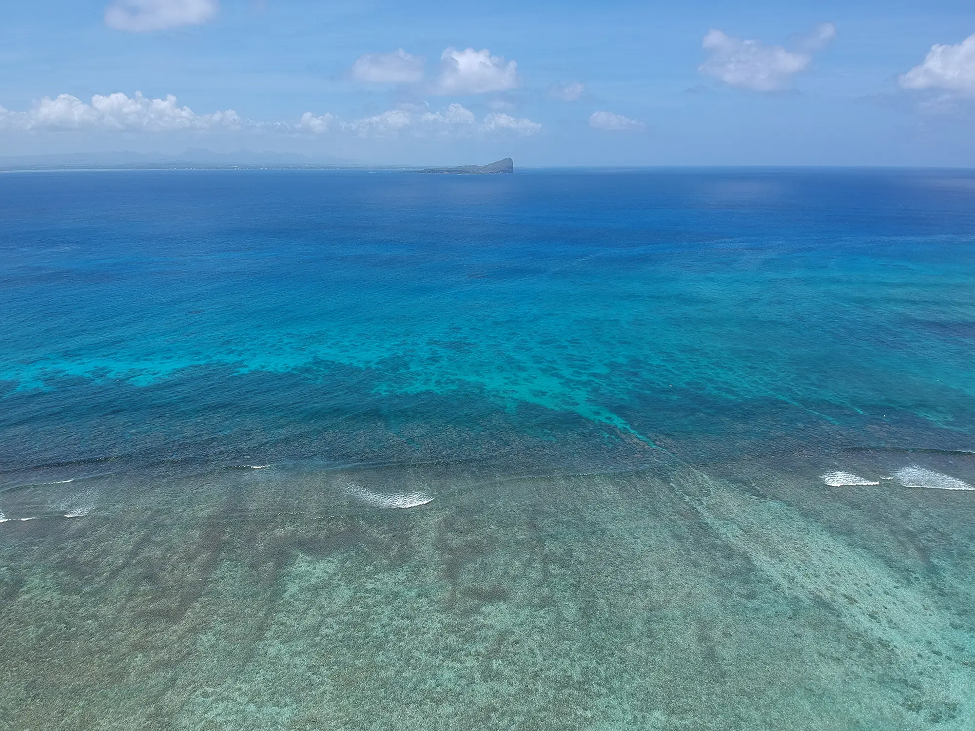 Aerial photograph of Ilot Gabriel, the northern islet off Mauritius, surrounded by turquoise shallows
