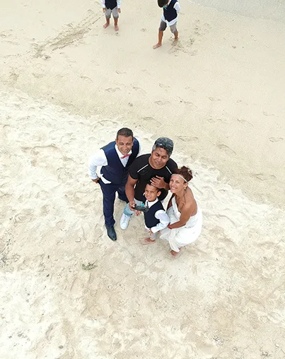 Bilaal Sadeer photographing a family with drone on a Mauritius beach